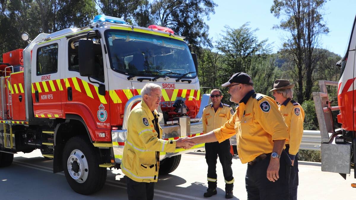 NEW CHAPTER: Broke Brigade Captain Paul Myers and Wollombi Fire Brigade Captain of Robert Tulloch at the grand opening. 
