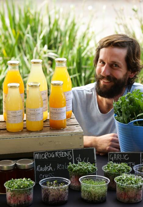 CORDIAL: Farmer Tom Christie of Four Acre Farm near Dungog with the cordial he transformed from citrus trees on his farm. 