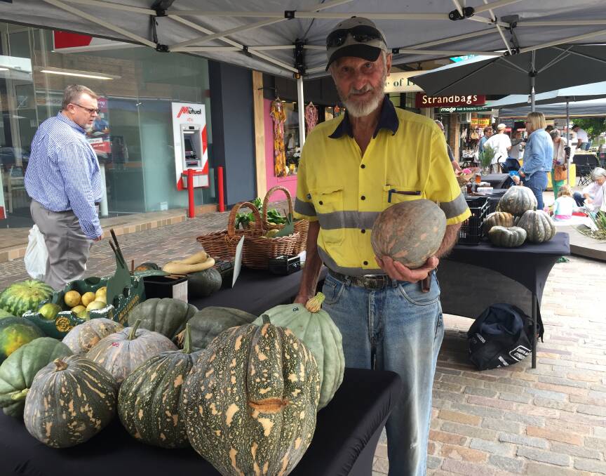 HOPEFUL: Oakhampton farmer Austin Breiner with some of the pumpkins he has kept alive at the Slow Food Earth Market Maitland in The Levee.