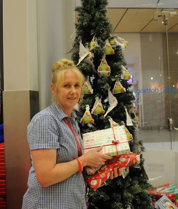CHRISTMAS APPEAL: Kmart Maitland's Wendy Ralston is asking people to give generously to the Wishing Tree appeal and help the less fortunate this Christmas. Picture: Belinda-Jane Davis