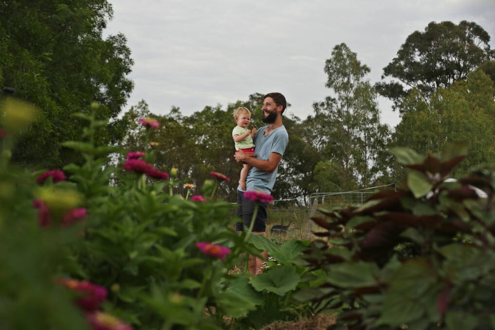 FLASH BACK: Small-scale farmer Tom Christie with daughter Evelyn at Four Acre Farm. 