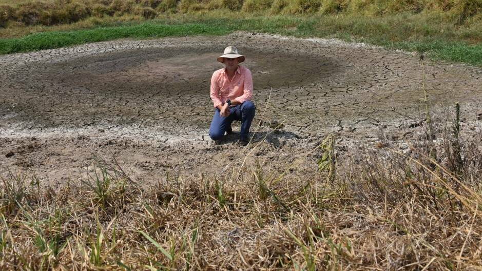 DROUGHT: NSW Primary Industries Minister Niall Blair in an empty dam at Stroud during a farm tour in February 2018.