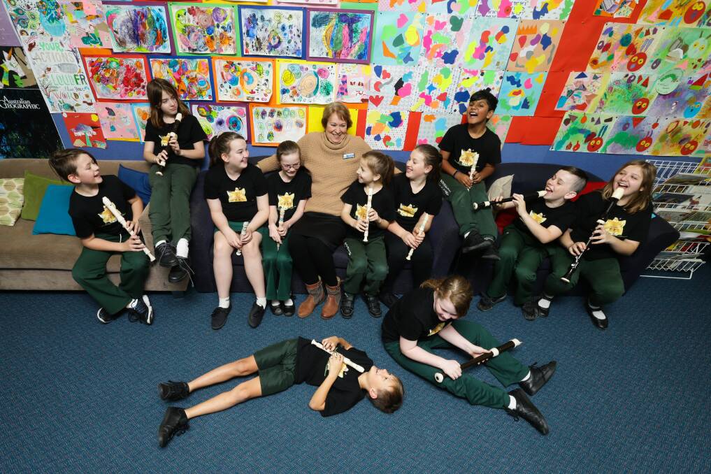 TEACHING: Music teacher Helen Tuyl with her music students at Millers Forest Public School. Picture: Jonathan Carroll. 