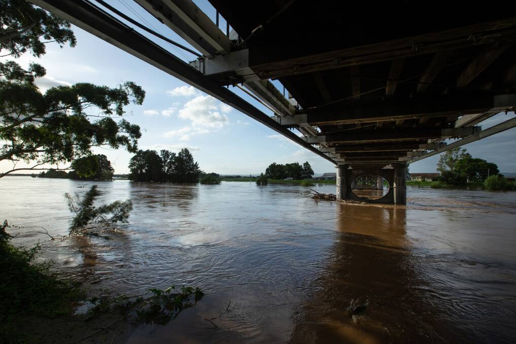 SWOLLEN: The Hunter River in flood underneath the Morpeth Bridge last week. Picture: Marina Neil