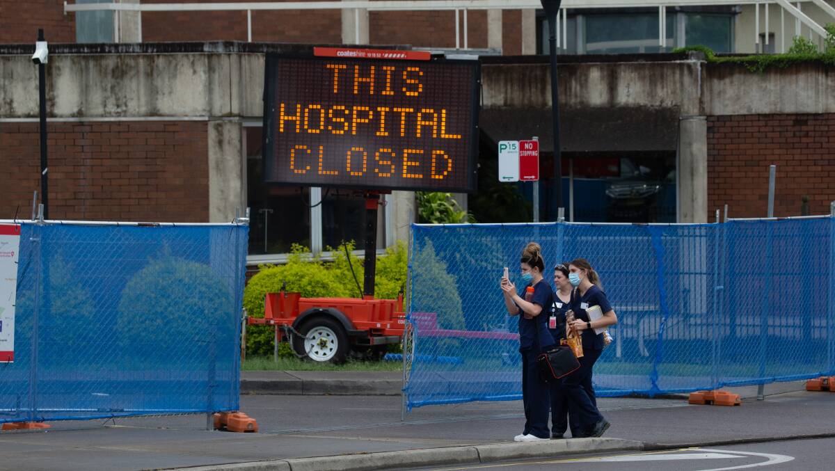 CLOSED: Staff standing in front of the old Maitland Hospital site last month. Picture: Marina Neil