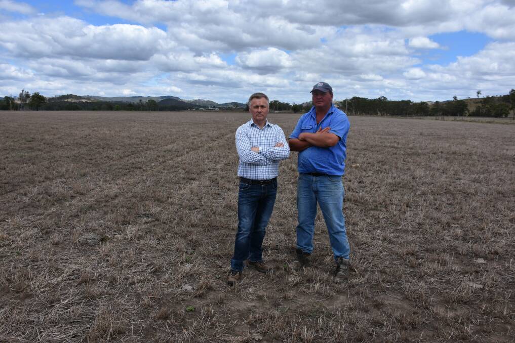 THE BIG DRY: Opposition spokesman for primary industries Mick Veitch with Wallarobba dairy farmer Jamie Marquet during a visit to the Hunter in February 2018. 