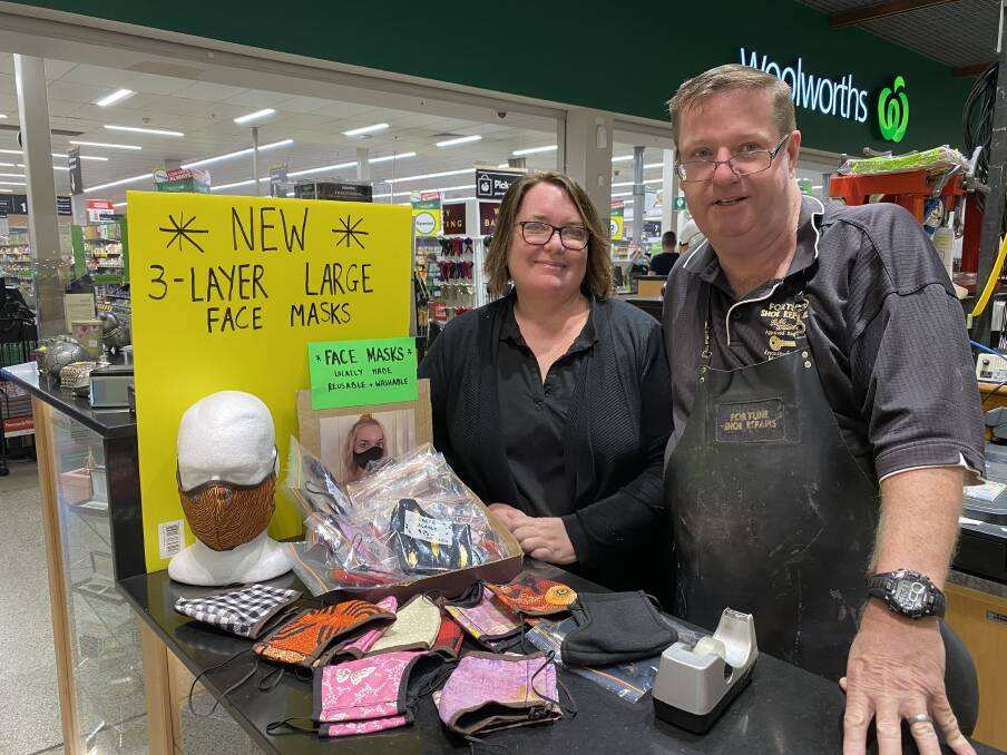 NEW TREND: Ainslie and James Fortune, of Fortune Shoe Repairs, with some fabric face masks. Picture: Michael Hartshorn. 