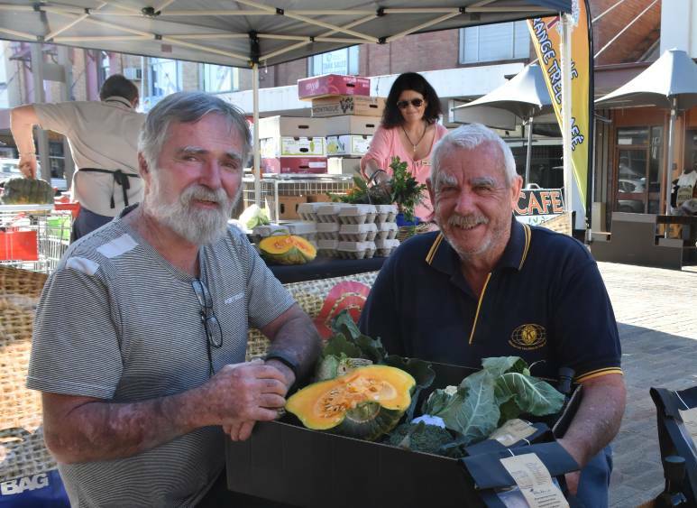 UPPER HUNTER FOCUS: Slow Food Hunter Valley volunteers Terry Kavanagh and Tony Milburn a fresh food box that went to a drought-stricken farmer last year.