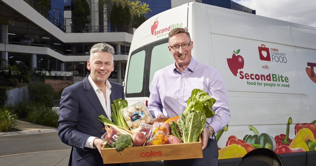 HELPING: Coles managing director John Durkan and SecondBite CEO Jim Mullan with some of the surplus fresh produce that is turned into meals for the needy. 