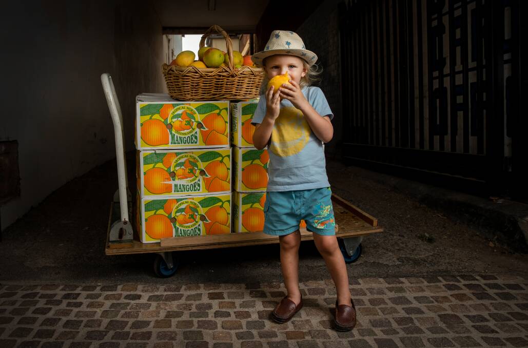SO GOOD: Ziggy Czado, 3, bites into a north Queensland mango. 