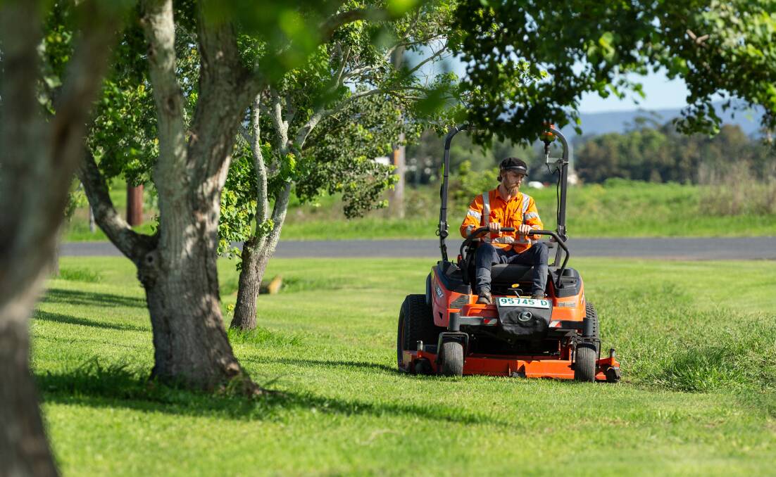 GRASS GALORE: Sonny Morrison, of Summit Open Space Services, is busy keeping lawns short amid a sudden growth spurt. Picture: Max Mason-Hubers