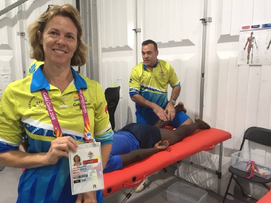 VOLUNTEER: Maitland Physiotherapy and Sports Injuries physiotherapist Alison Strudwick in the Polyclinic at the Gold Coast Commonwealth Games. 