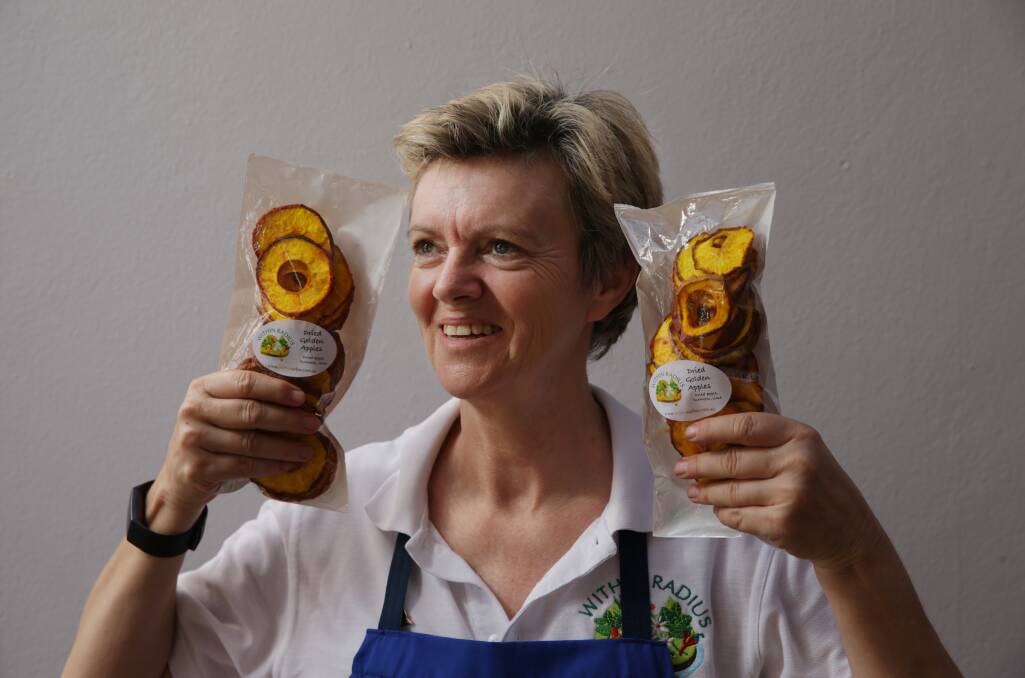 PRESERVING FOCUS: Telarah producer Liz Griffiths with her dried apple soaked in turmeric. Picture: Simone De Peak