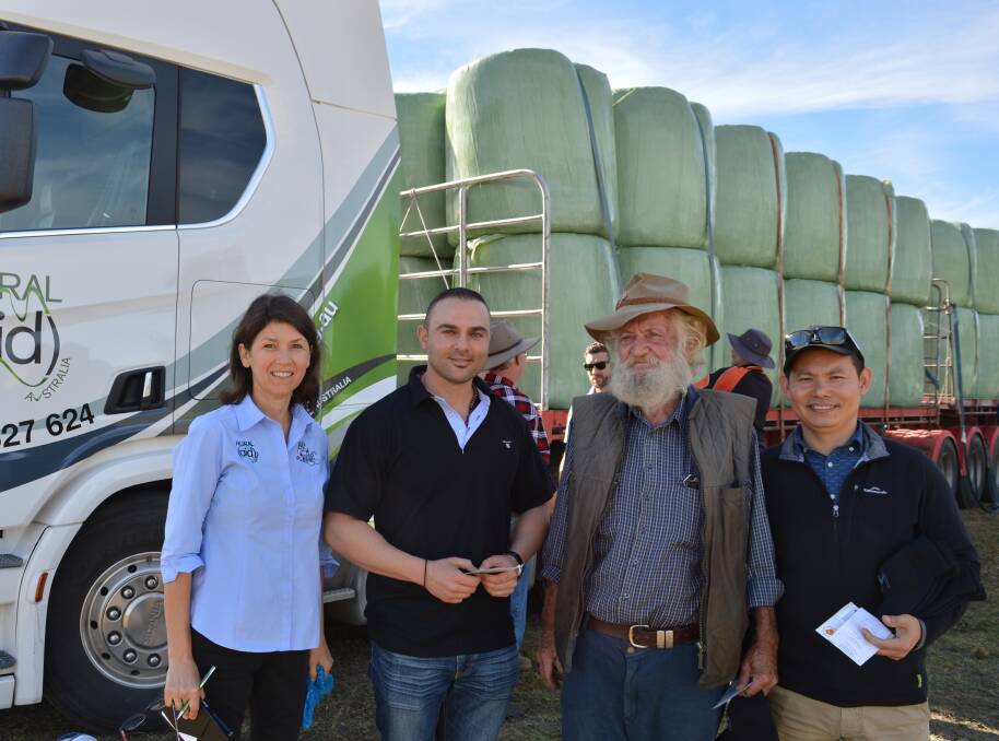 HAY DELIVERY: Rural Aid Gift of Music program director Robyn Thomson, Sessien Sarkis from Meriton, farmer Bob Kidd and Linh Tran from Meriton.