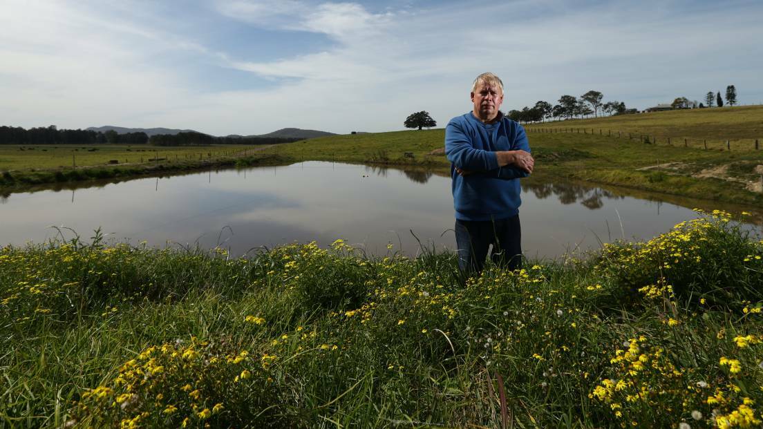 CONCERNED: Farmer Peter Manuel at the dam near the boundary he will share with the housing estate, if it is approved. Picture: Jonathan Carroll