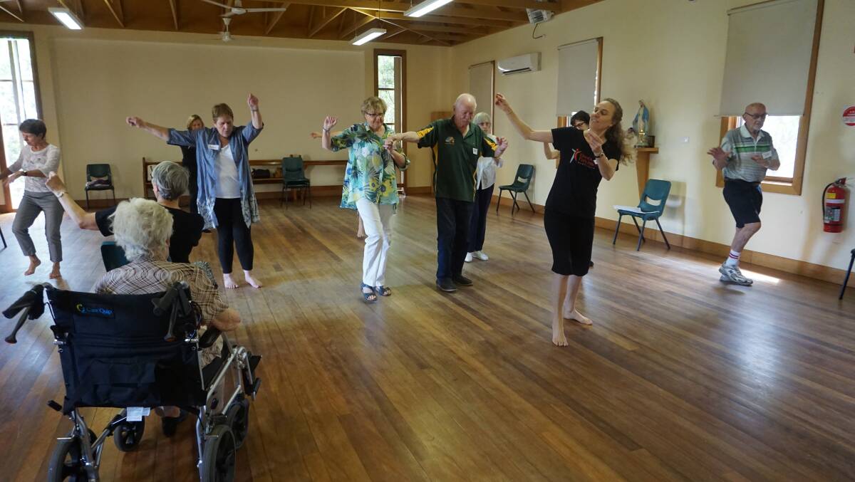 IMPROVING: Robert Shaw (centre) and Jenni Langham (fourth from left) follow Maitland Dance for Parkinson's class instructor Mikola Lee. Picture: Belinda-Jane Davis