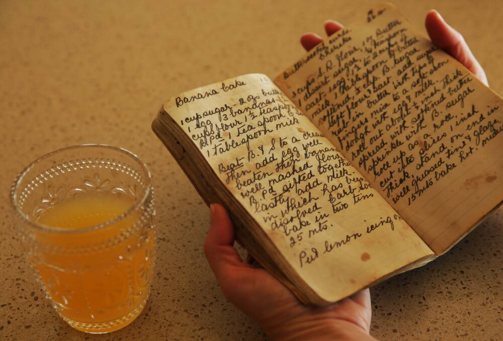CLASSIC: A glass of Ceylon Punch and Nana Ling's handwritten recipe book. Picture: Simone De Peak