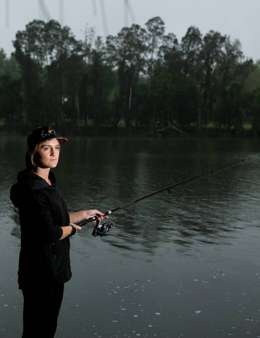 FISHING: Ellie Burke enjoys fishing from the boat ramp at her family's property in Clarence Town. Picture: Marina Neil. 