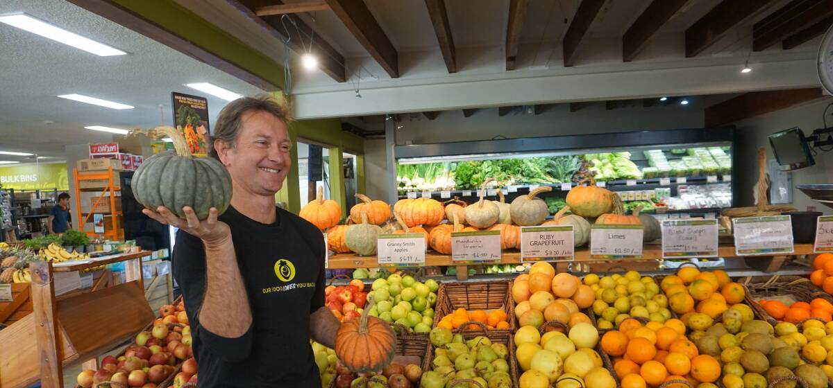 FOR THE LOVE OF FOOD: Organic Feast owner Brent Fairns holds organic pumpkins grown in the Hunter region. 