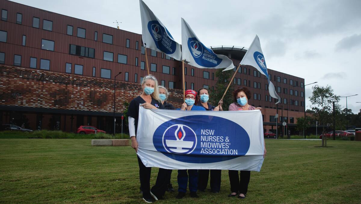 EXHAUSTED: NSW Nurses and Midwives Association Maitland Branch members outside the new Maitland Hospital earlier this year. 