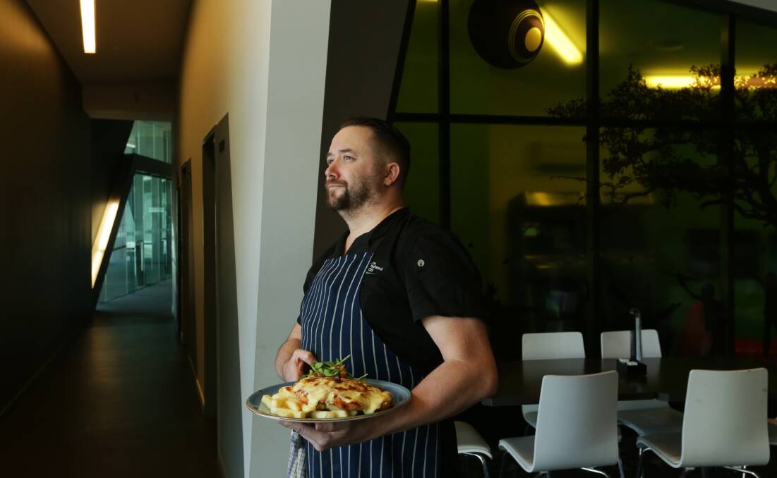 THE BIG DRY: Brent Field, head chef at Quarry Bar and Grill at Club Maitland City, with a chicken parma. Picture: Simone De Peak.