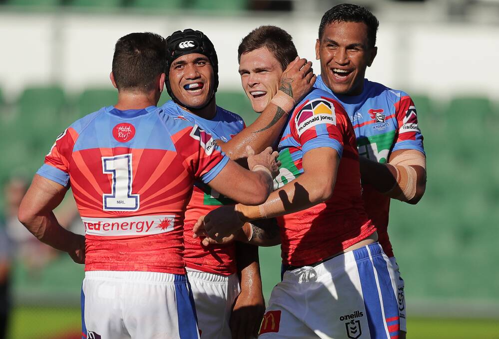 HAPPY DAYS: Newcastle players are all smiles after Brodie Jones scores in their 34-0 slaughter of the Warriors in Perth on Friday. Picture: Getty Images