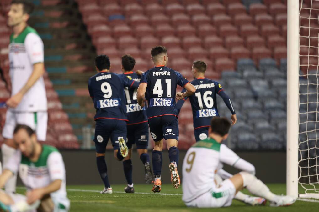 ON TARGET: Adelaide celebrate George Blackwood's goal in the 2-0 win over the Newcastle Jets' at McDonald Jones Stadium on Saturday night. Picture: Getty Images 