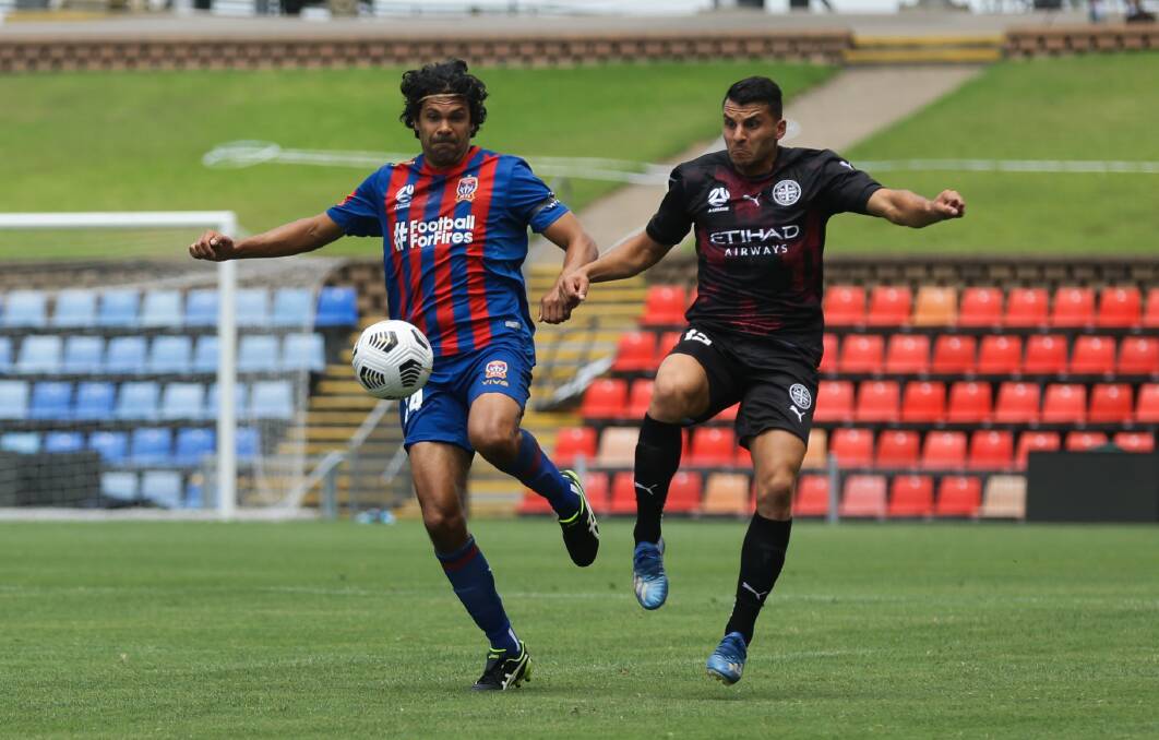 ON THE BALL: Jets defender Nikolai Topor-Stanley wins possession ahead of Melbourne City striker Andrew Nabbout in the 3-all draw on Saturday. Picture: Jonathan Carroll