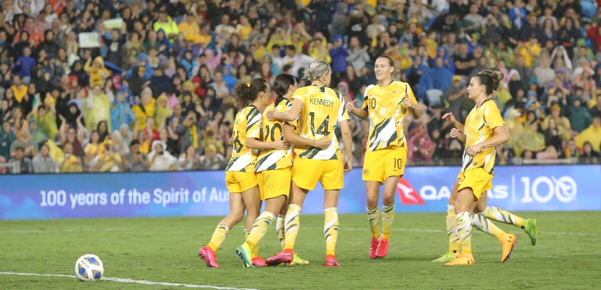 CENTRE STAGE: Emily Van Egmond (No.10) congratulates Sam Kerr after her goal in the Matildas' 5-0 win over Vietnam. Picture: Max Mason-Hubers