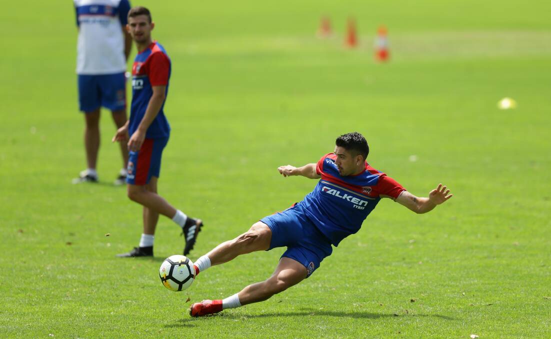 FINISHING SCHOOL: Dimi Petratos crunches a volley at Newcastle Jets training on Wednesday. The Jets face a hectic schedule of four games in 14 days. Picture: Jonathan Carroll