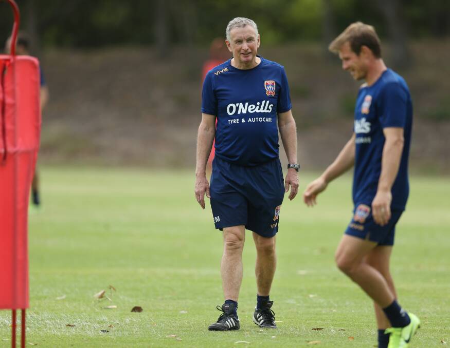POSITIVE: Ernie Merrick shares a laugh with Nick Fitzgerald at Jets training on Wednesday. Picture: Marina Neil