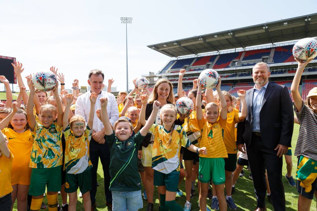 GAME ON: Young fans join Jets CEO Lawrie McKinna, City of Newcastle Councillor Peta Winney-Baartz and Venues NSW Newcastle manager Dean Mantle for the launch of the Matldas' Olympic qualifier against Vietnam. Pictures: Max Mason-Hubers