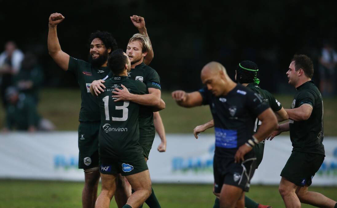 CLUTCH PLAY: Merewether celebrate after Sam Bright (centre) landed a penalty on full-time to snatch a 31-29 win over Maitland at No.2 Sportsground on Saturday.
