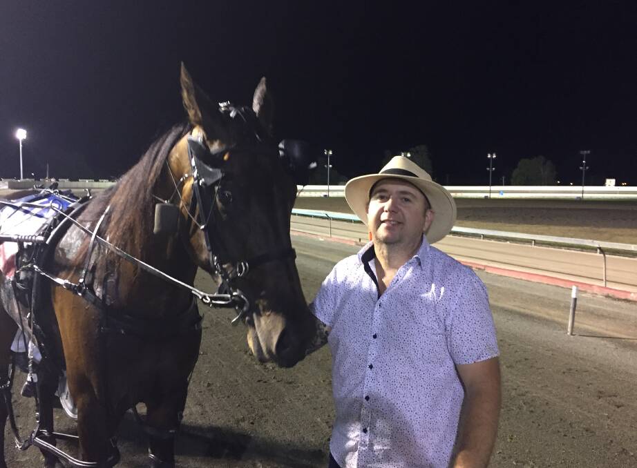 BIG NIGHT: Trainer Trevor Munday with Benalong Valley after their Inter City Pace triumph.