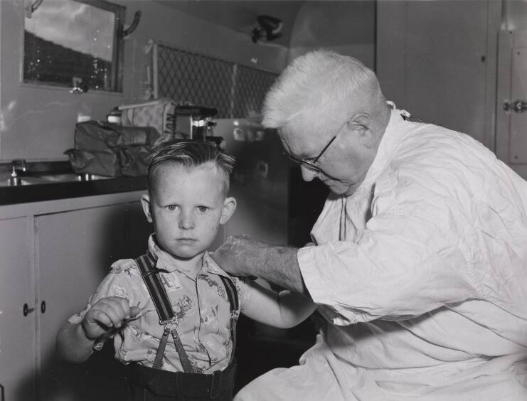 Doctor vaccinating a child for polio in a mobile clinic as part of an anti-polio campaign in Western Australia, July 1956. Picture supplied by National Museum of Australia.