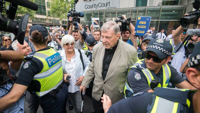 ardinal George Pell leaving the County Court. Photo: Justin McManus
