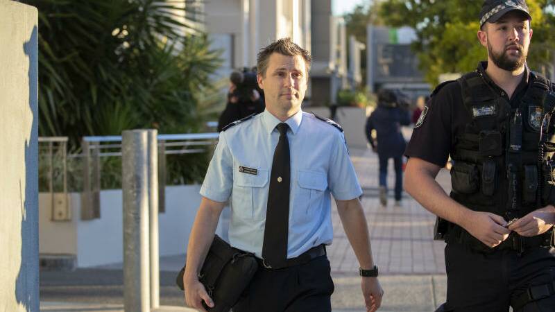 Forensic crash investigator Senior Constable Steven Cornish leaves the Southport Magistrates Court after giving evidence at the coroner's inquest.
