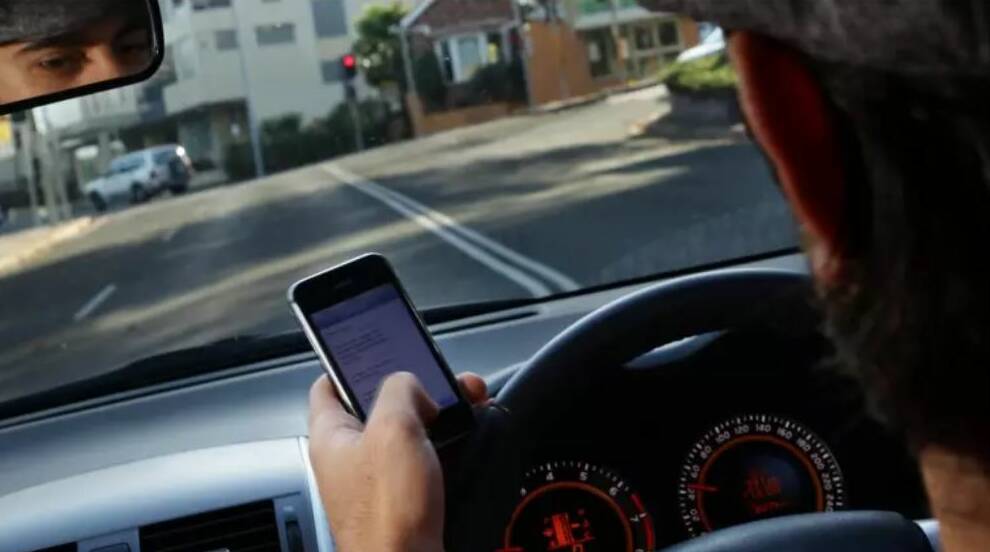 Road safety experts have been shocked by the lengths motorists go to hide mobile use. Photo: Ken Robertson