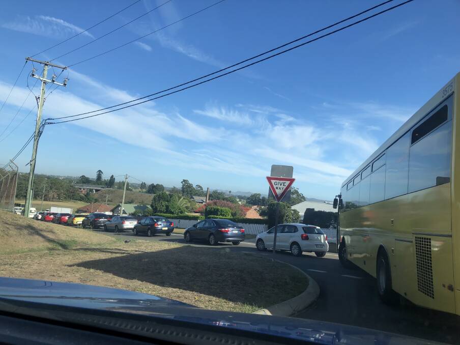 LINE: Traffic banked up heading down the gaol hill towards the roundabout at East Maitland on Tuesday morning.