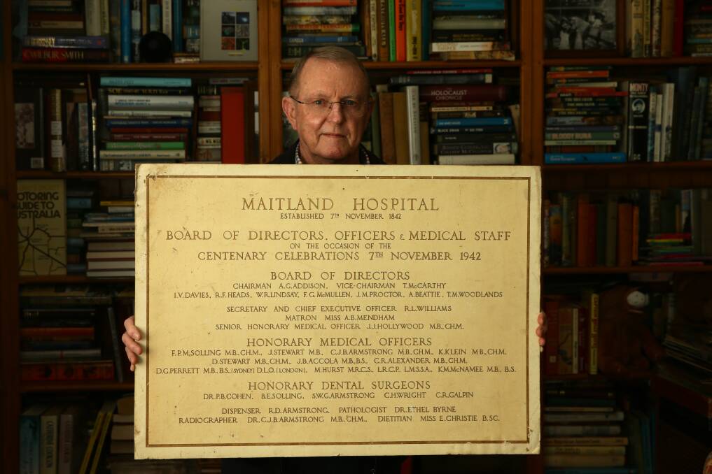 MEMORIES FOUND: Geoff Boyle pictured with the Maitland Hospital Centenary Board of Directors sign. PICTURE Jonathan Carroll.