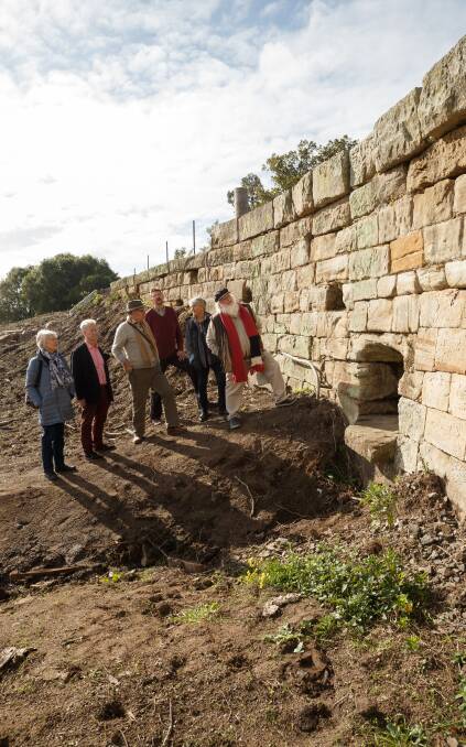 NEW GROUP: Heritage Guardians Heather Barry, Chris Richards, Bob Dennerley, John Rademaker, Penny Kaper and Frank Oakes at a recently rediscovered convict-built bridge in Morpeth. Picture: Max Mason-Hubers