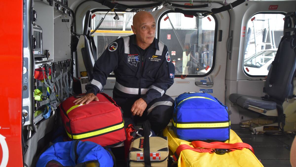 Dr Rob Bartolacci with some of the gear in the back of the chopper.