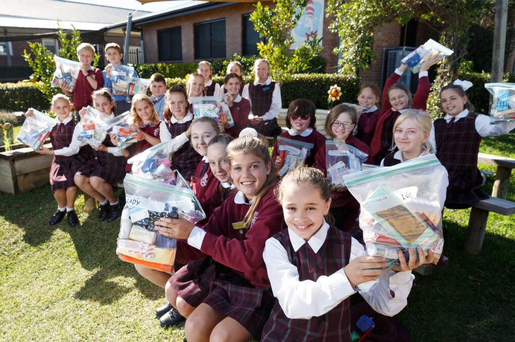 GOOD CAUSE: St Paul's Primary School students with the dignity packs which they put together for the homeless as part of the Mini Vinnies School Sleepout. Picture: Max Mason-Hubers 