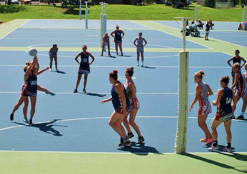 TUSSLE: The Kurri Kurri opens competing against Gosford in the Hunter Regional League netball competition earlier this year.