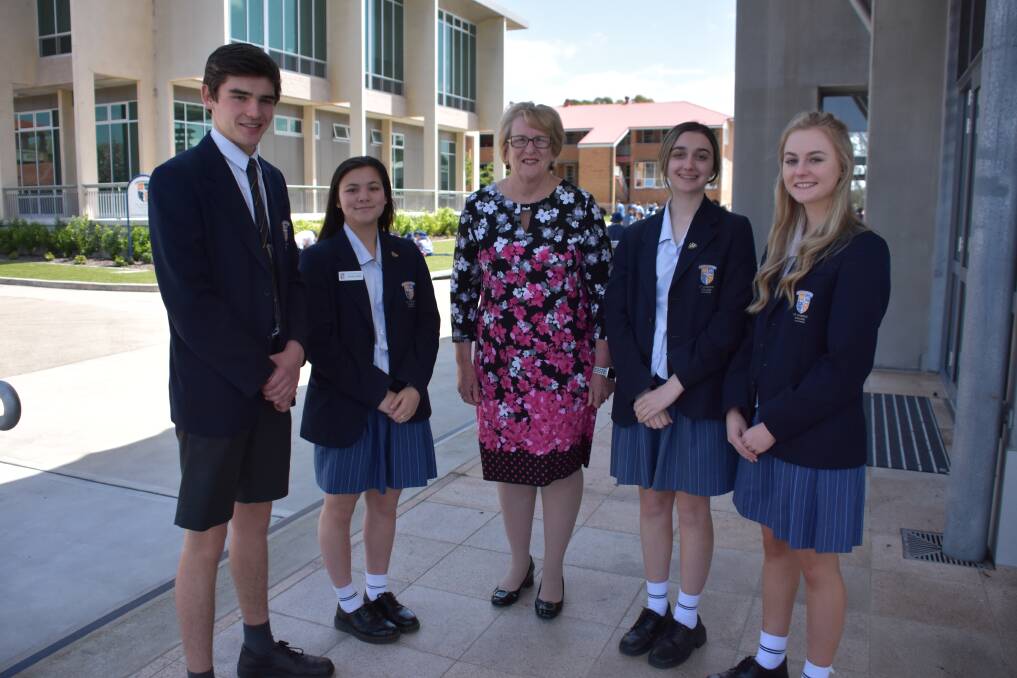 READY: St Joseph's College Lochinvar HSC students Noah Hurn, Mary Wright, Abey Matt and Isabella Crebert with principal Patricia Hales (centre).