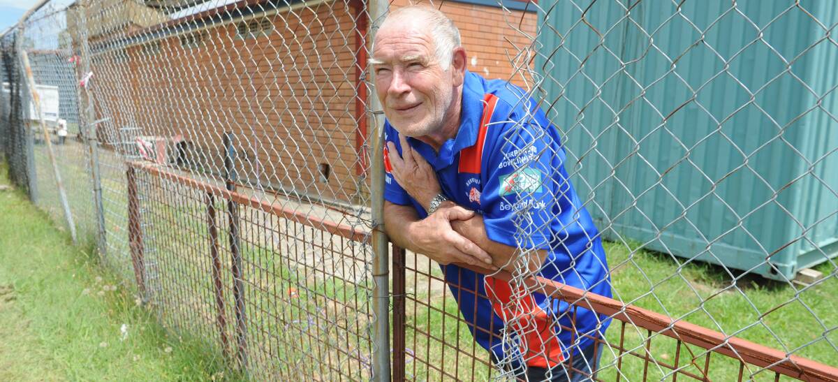 DAMAGE: Kurri Kurri Bulldogs ground manager Chris Doyle inspects the hole that vandals cut to gain access to the ground on Sunday.