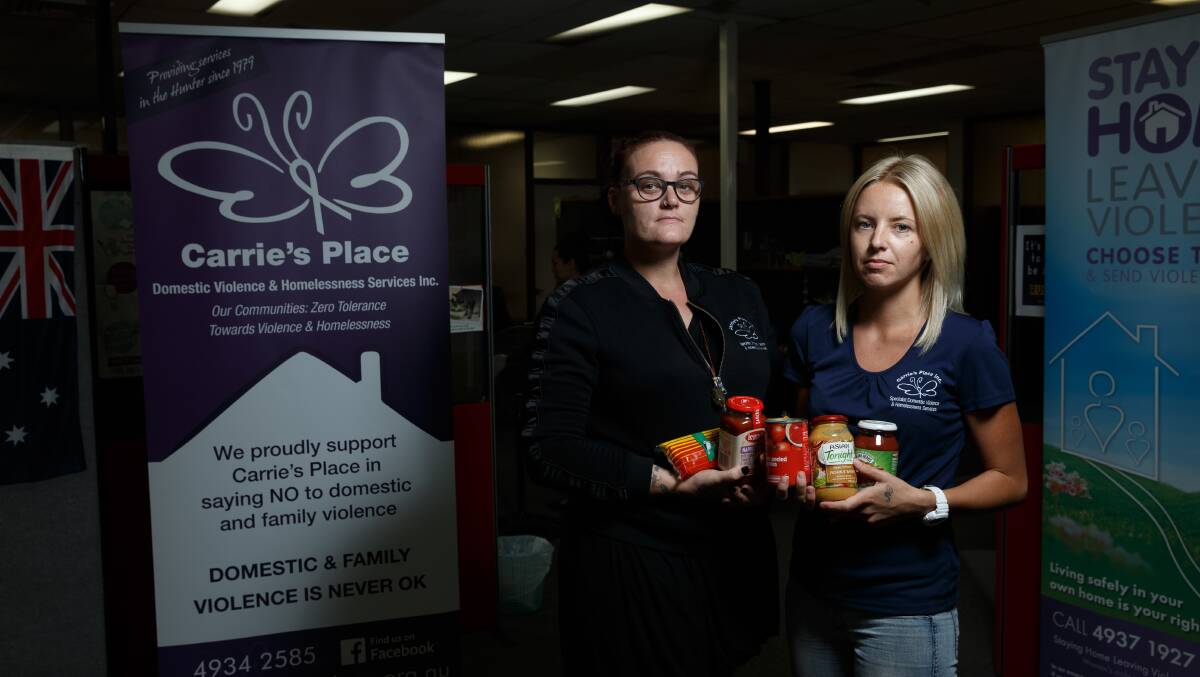 DRIVE: Carrie's Place case workers Fiona Richards and Sam Allen with some of the non-perishable food recently donated. Picture: Max Mason-Hubers