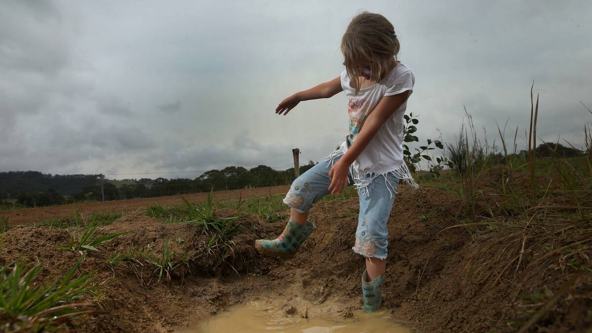 Mia Carroll enjoys the puddles at Mount Vincent earlier this month. Picture: Marina Neil