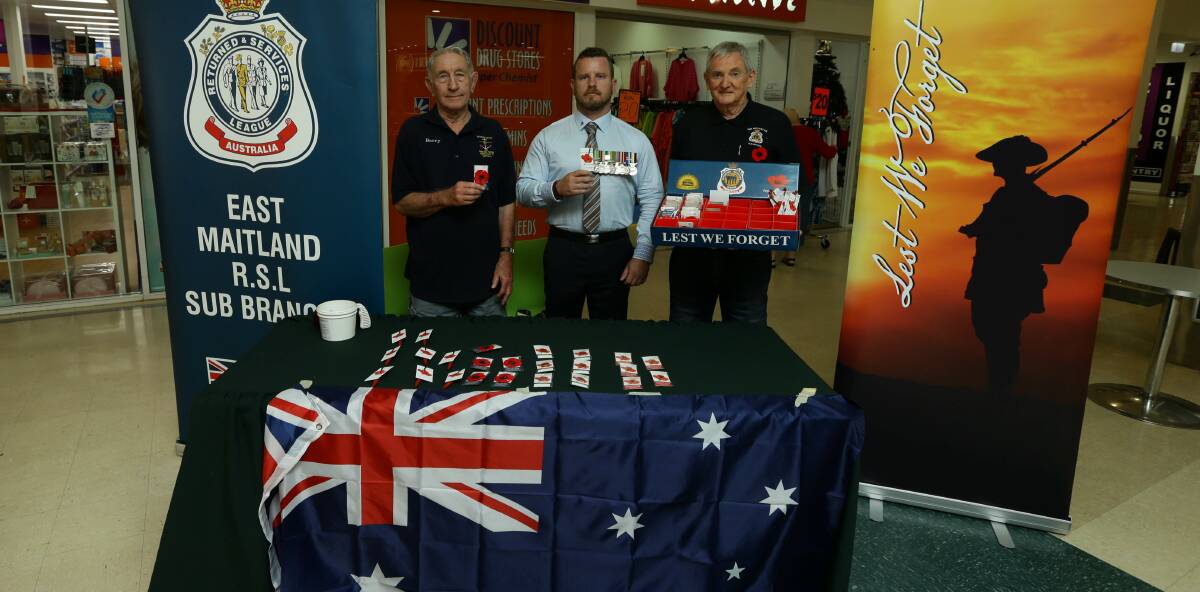 SUPPORT: East Maitland RSL Sub-Branch's Barry Salmon, Adrian Humphries and Brad Keating selling badges. Picture: Jonathan Carroll