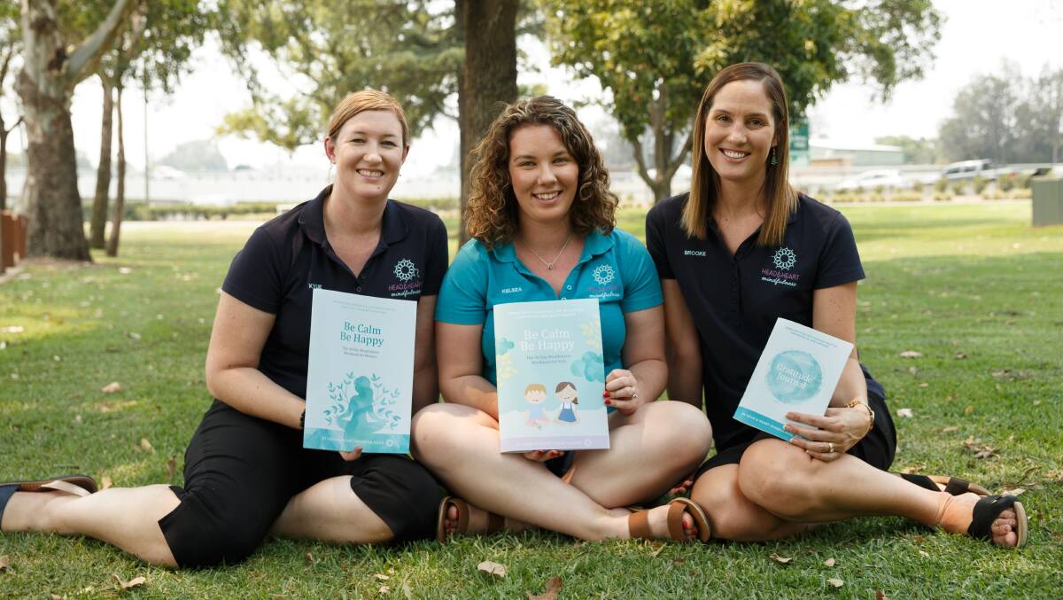 Kylie Humphreys, Kelsea Winfield and Brooke Vitnell from Head & Heart Mindfullness with three new books they've launched. Picture: Max Mason-Hubers